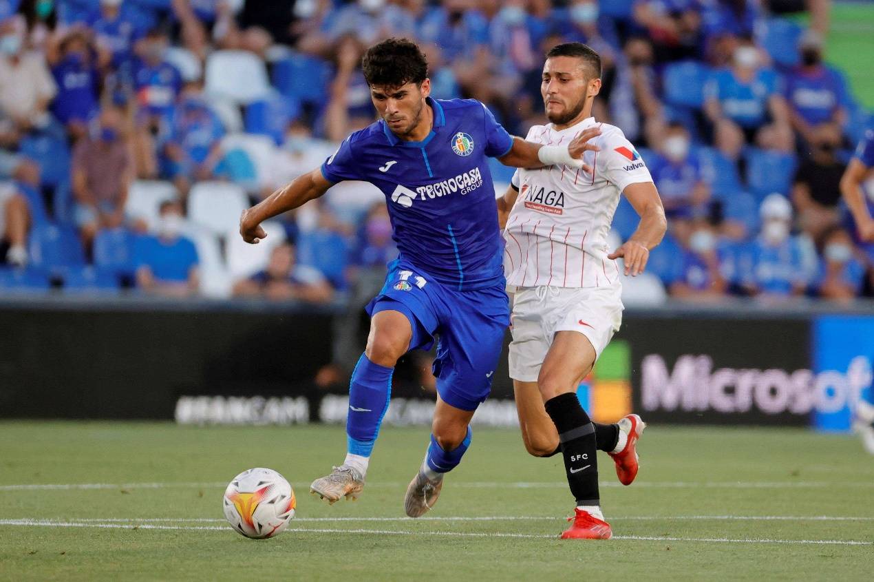 包含赫塔菲客场击败西班牙人，重返胜轨的词条